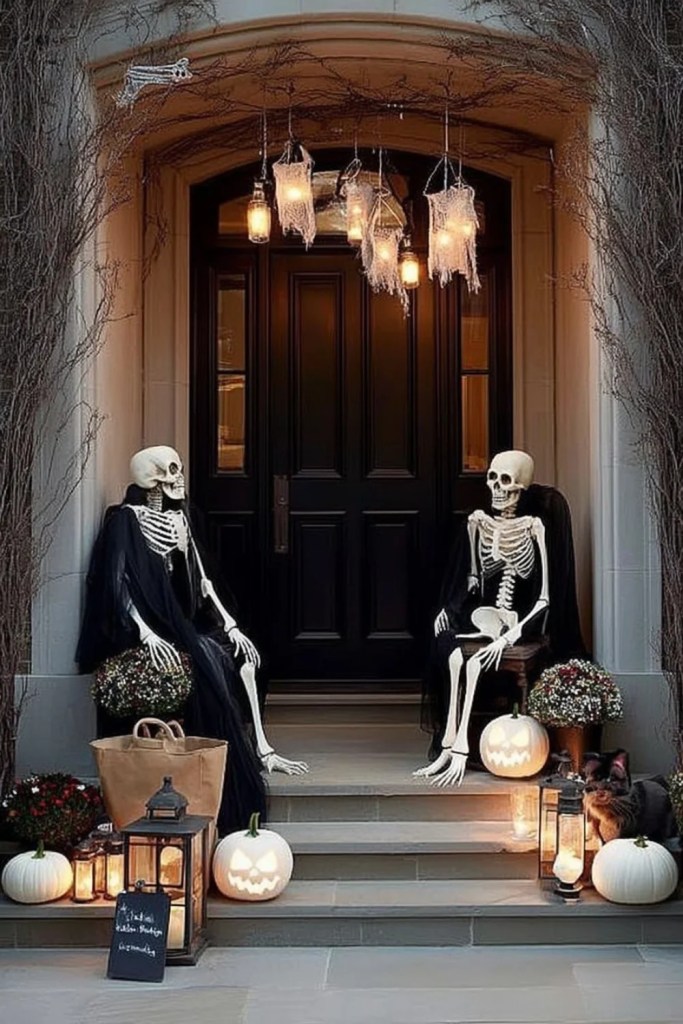 Skeleton Duo Sitting on the Porch Steps-halloween front porch ideas-loves from bet