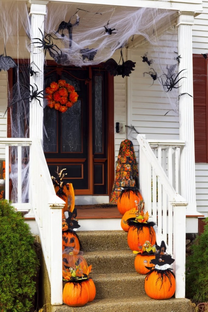 Giant Spider Web Porch With Witch Hats & Pumpkins-halloween front porch ideas-loves from bet
