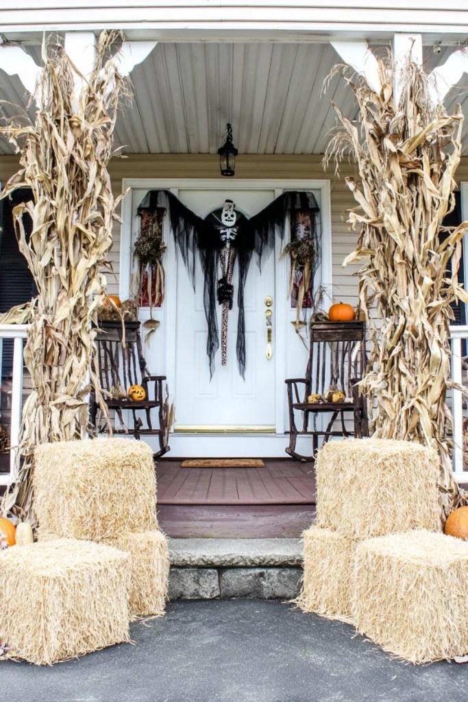 Cornstalk Porch With Rocking Chairs and Pumpkins-halloween front porch ideas-loves from bet