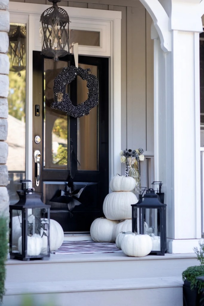 Minimal White Pumpkin Porch With Black Wreath-halloween front porch ideas-loves from bet